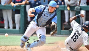 Arizona's Adonys Guzman (18) slides into home plate to score beating the throw to North Carolina catcher Luke Stevenson (44) . The North Carolina Tar Heels and the Arizona Wildcats met in game two of the NCAA Division 1 Super Regionals in Chapel Hill, N.C. on June 7, 2025.