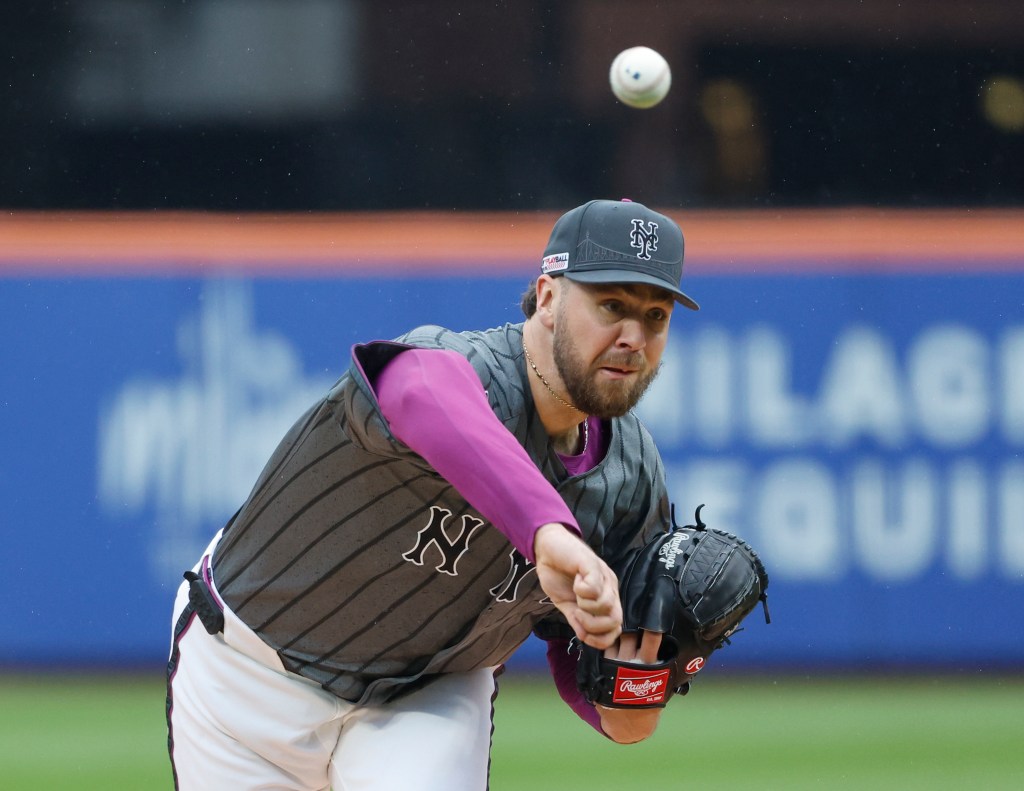 New York Mets pitcher Tylor Megill throws a pitch.