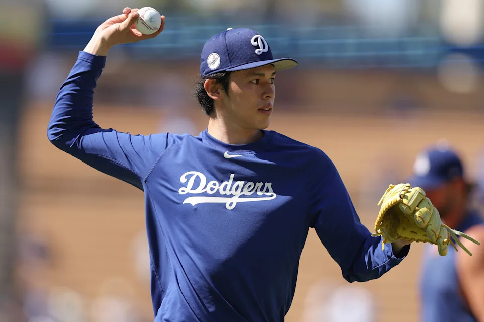 FILE - Los Angeles Dodgers pitcher Roki Sasaki warms up before a baseball game against the Toronto Blue Jays, Aug. 9, 2025, in Los Angeles. (AP Photo/Jessie Alcheh, File)