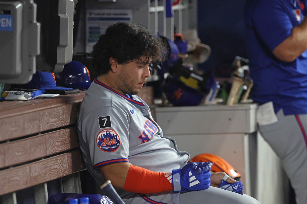 Francisco Alvarez #4 of the New York Mets reacts in the dugout after he grounds out to the catcher during the 9th inning. The Miami Marlins defeat the New York Mets 6-2.