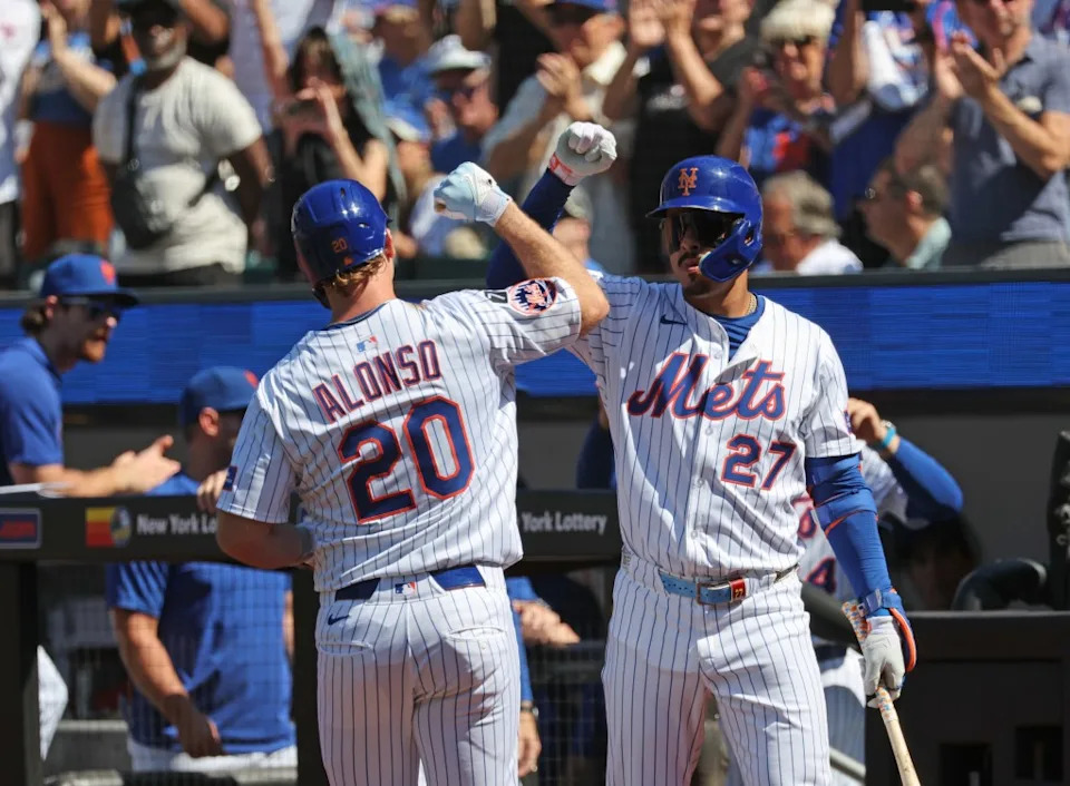 Mets first baseman Pete Alonso #20 is greeted by DH Mark Vientos #27 after he scores on his solo homer in the 1st inning. Charles Wenzelberg / New York Post