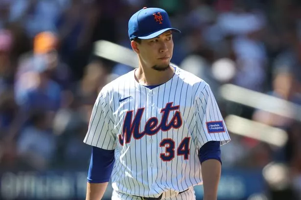 Kodai Senga #34 of the New York Mets looks back after being taken out of the game against the Miami Marlins at Citi Field on August 31, 2025 in New York City