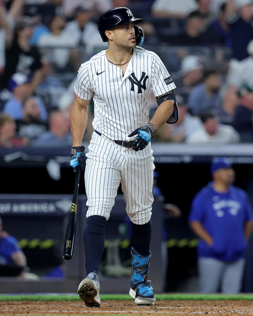 Giancarlo Stanton watches his solo home run against the Toronto Blue Jays.