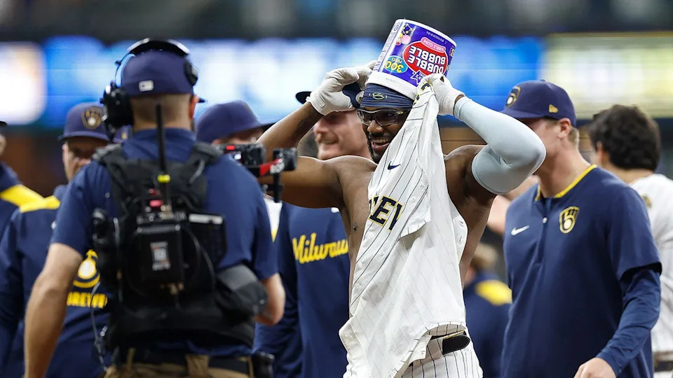 <div>Andruw Monasterio congratulated by teammates after a walk-off single against the St. Louis Cardinals. (Photo by John Fisher/Getty Images)</div>