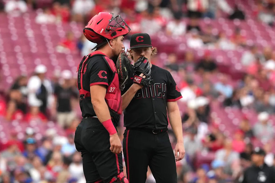 Catcher Tyler Stephenson talks with starting pitcher Andrew Abbott during the Mets' three-run first inning at at Great American Ball Park on Sept. 5. Abbott allowed five runs in 4 2/3 innings on nine hits and walk while striking out five.