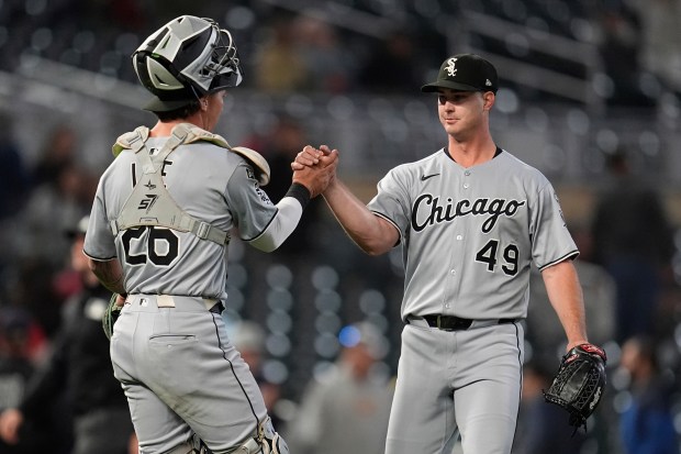 White Sox catcher Korey Lee, left, and reliever Jordan Leasure celebrate after a 4-3 wn against the Twins on Sept. 3, 2025, in Minneapolis. (Abbie Parr/AP)