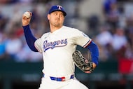 Texas Rangers pitcher Tyler Mahle delivers during the first inning of baseball game against...