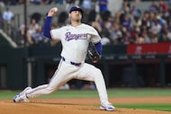 Texas Rangers pitcher Tyler Mahle (51) throws a pitch during the first inning of a baseball...