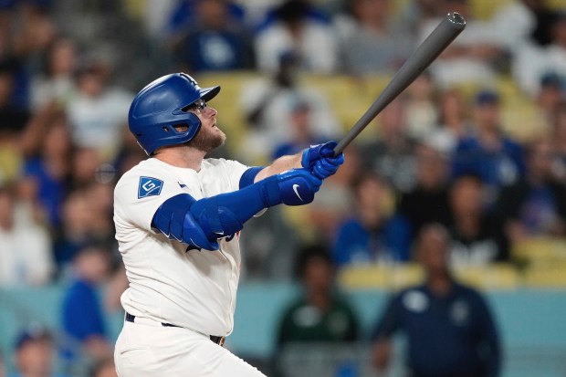 The Dodgers’ Max Muncy flies out during the second inning...