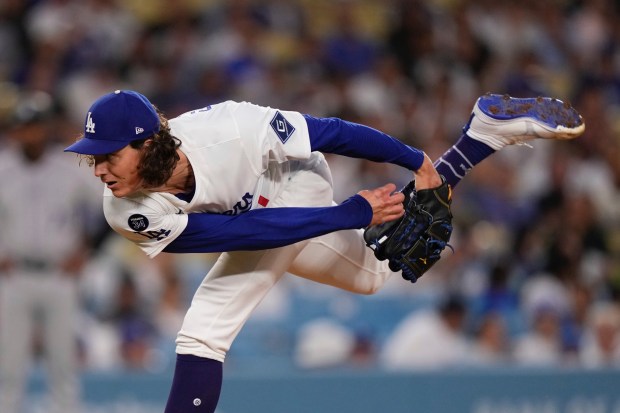 Dodgers starting pitcher Tyler Glasnow throws to the plate during...