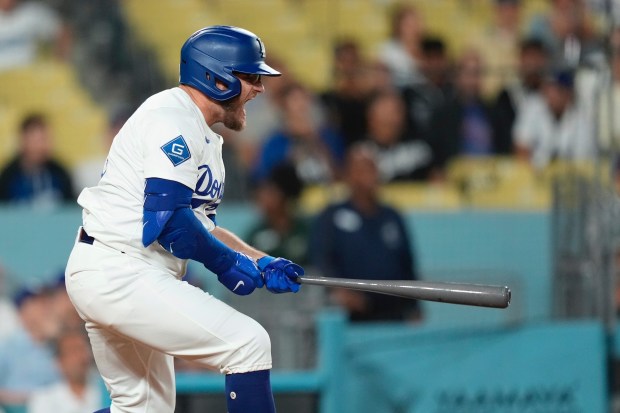 The Dodgers’ Max Muncy yells as he flies out during...