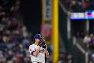 Texas Rangers starting pitcher Jacob deGrom works against the Houston Astros during a...