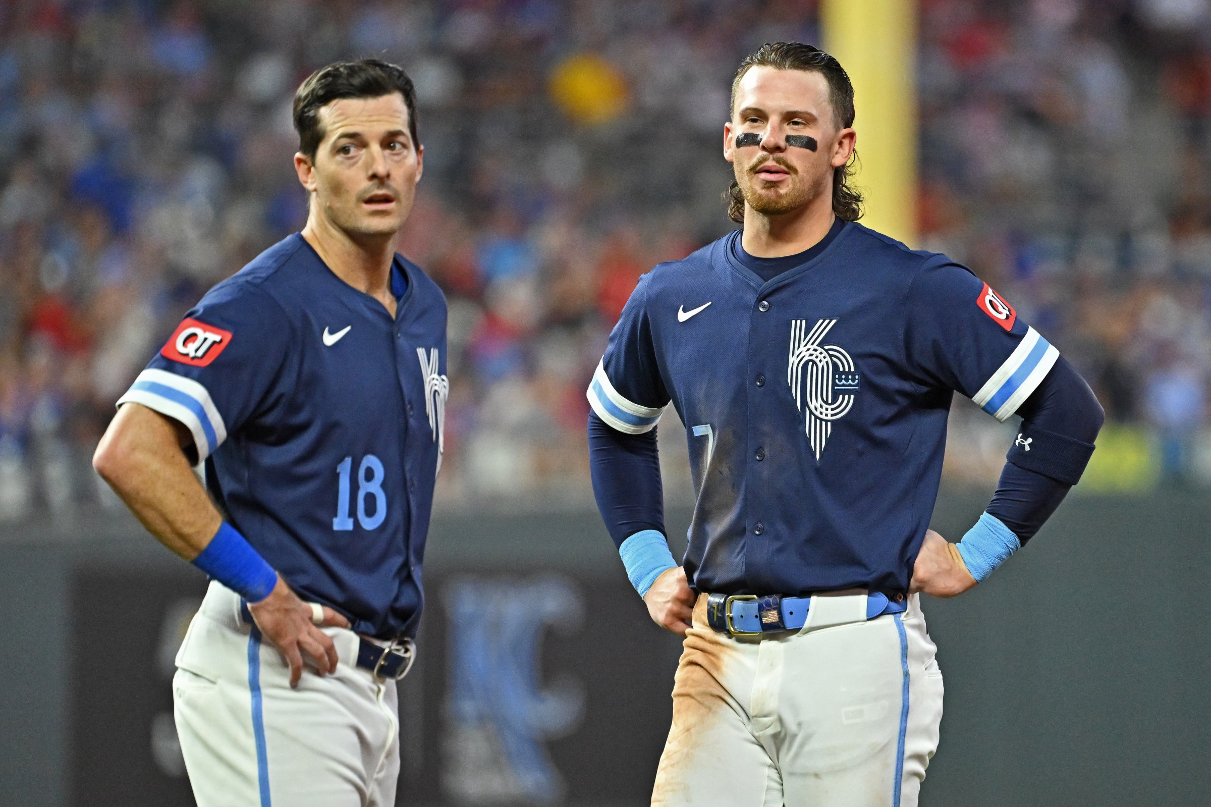 Aug 29, 2025; Kansas City, Missouri, USA; Kansas City Royals shortstop Bobby Witt Jr. (7) and right fielder Mike Yastrzemski (18) look on at the end of the second inning against the Detroit Tigers at Kauffman Stadium. Mandatory Credit: Peter Aiken-Imagn Images