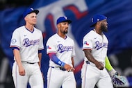 Texas Rangers shortstop Corey Seager (from left, second baseman Marcus Semien and outfielder...