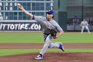 Texas Rangers starting pitcher Jacob deGrom throws against the Houston Astros during the...