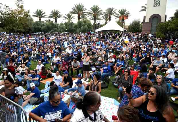 Dodger fans gather at the Ontario Town Center during the...