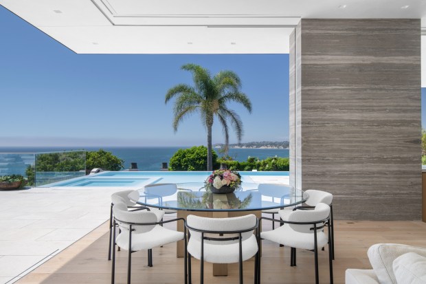 Dining table overlooking wraparound deck.