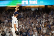 Los Angeles Dodgers starting pitcher Clayton Kershaw (22) waves toward the stands before a...