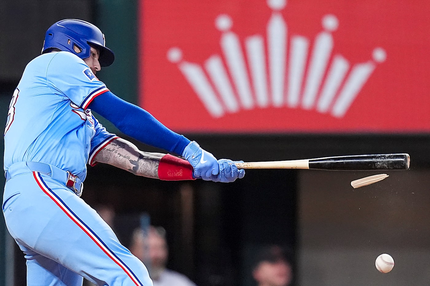 Texas Rangers catcher Jonah Heim breaks his bat as he fouls off a pitch during the fourth...