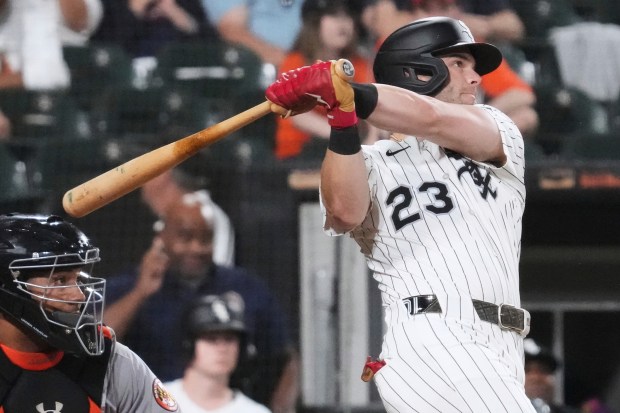 Chicago White Sox's Andrew Benintendi hits a two-run home run during the eighth inning of a baseball game against the Baltimore Orioles in Chicago, Tuesday, Sept. 16, 2025. (AP Photo/Nam Y. Huh)