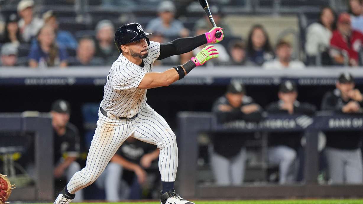 Yankees rally past White Sox 3-2, clinch playoff berth and close within 1 game of Toronto in AL East