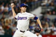 Texas Rangers starting pitcher Jacob deGrom (48) throws a pitch during the second inning of...