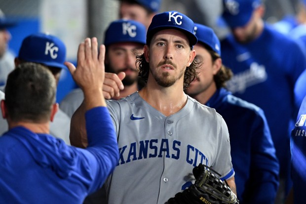 Kansas City Royals starting pitcher Michael Lorenzen walks through the...