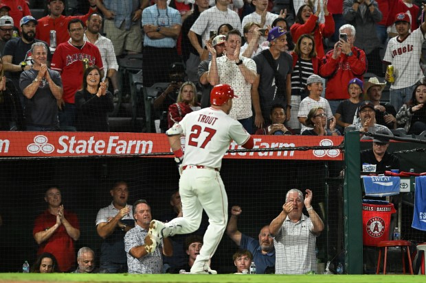 Angels star Mike Trout (27) celebrates after hitting a two-run...