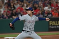 Texas Rangers starting pitcher Jacob Latz delivers against the Cleveland Guardians during...