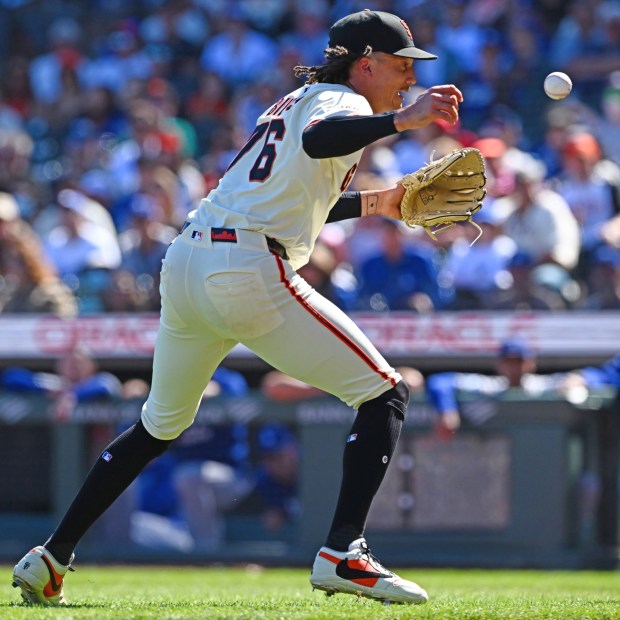 San Francisco Giants pitcher Spencer Bivens (76) bobbles a grounder hit by Los Angeles Dodgers' Michael Conforto (23) in the sixth inning of their MLB game at Oracle Park in San Francisco, Calif., on Sunday, Sept. 14, 2025. Conforto reached first base safely. (Jose Carlos Fajardo/Bay Area News Group)