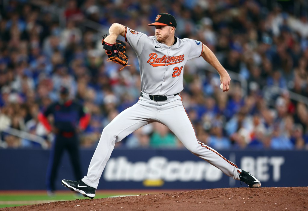 Baltimore Orioles pitcher throwing a baseball.