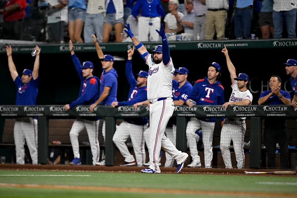 Texas Rangers first baseman Rowdy Tellez (44) celebrates with the team as Rangers pinch hitter Jake Burger (not pictured) hits a single and drives in the game-winning run against the Arizona Diamondbacks during the 10th inning at Globe Life Field on Aug. 11, 2025.