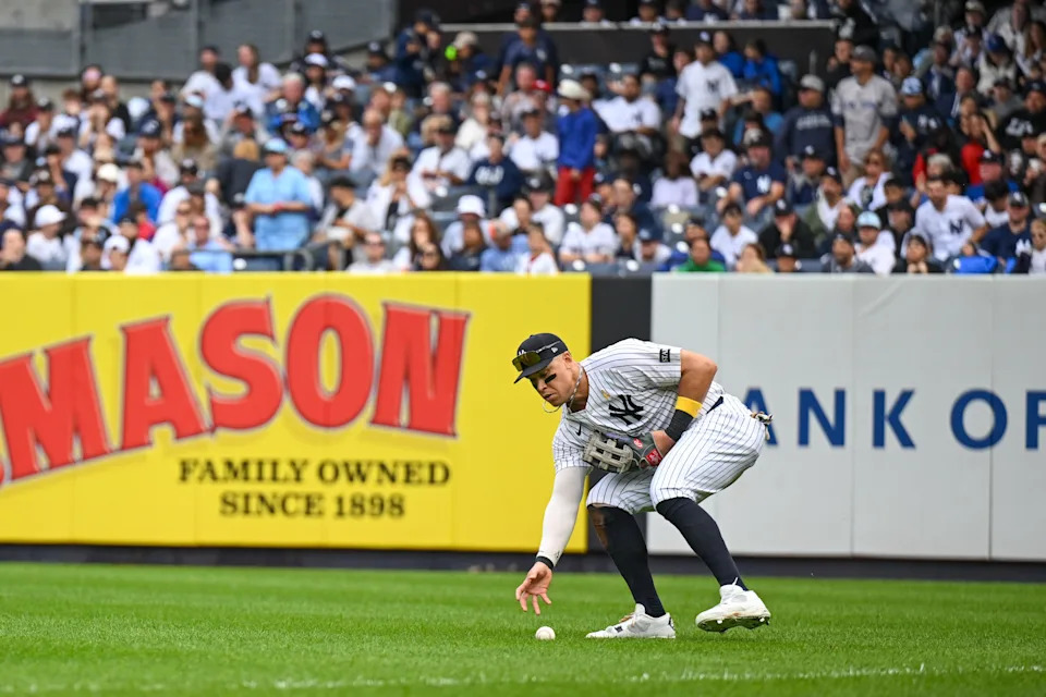 Sep 7, 2025; Bronx, New York, USA; New York Yankees right fielder Aaron Judge (99) fields the ball during the fourth inning against the Toronto Blue Jays at Yankee Stadium. Mandatory Credit: Mark Smith-Imagn Images