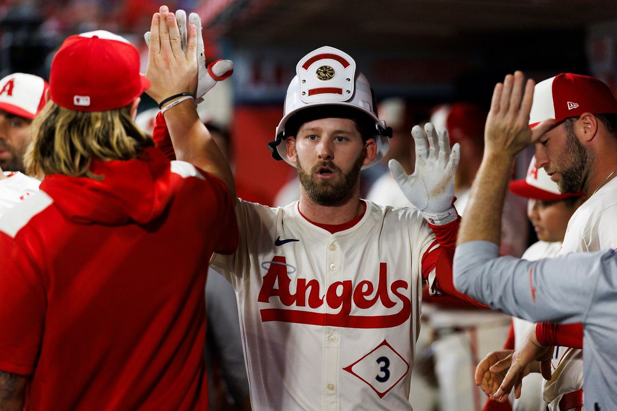 Taylor Ward #3 of the Los Angeles Angels celebrates in the dugout during the game against the Kansas City Royals at Angel Stadium of Anaheim on September 24, 2025 in Anaheim, California.