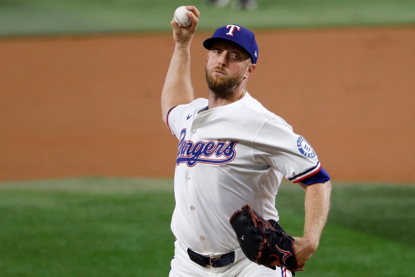 Texas Rangers pitcher Merrill Kelly (23) delivers during the first inning of a baseball game...
