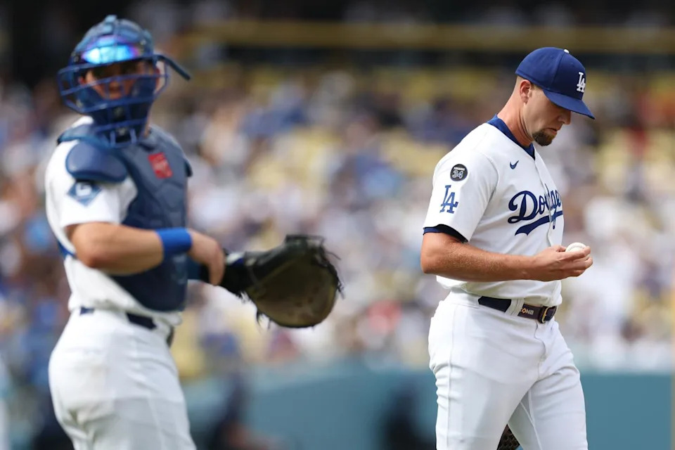 Dodgers pitcher Blake Treinen, right, reacts after giving up a bases-loaded walk to the Giants.