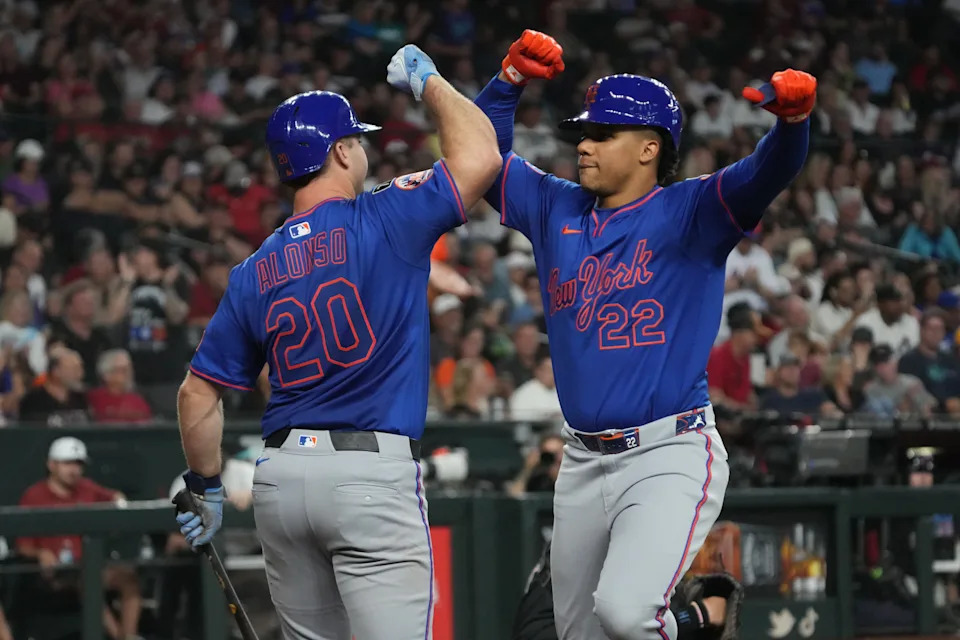 May 7, 2025; Phoenix, Arizona, USA; New York Mets outfielder Juan Soto (22) celebrates with first base Pete Alonso (20) after hitting a solo home run against the Arizona Diamondbacks in the sixth inning at Chase Field. Mandatory Credit: Rick Scuteri-Imagn Images