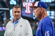 Texas Rangers president of baseball operations Chris Young talks with manager Bruce Bochy...