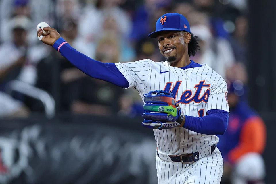 Sep 17, 2025; New York City, New York, USA; New York Mets shortstop Francisco Lindor (12) throws the ball to first base for an out during the first inning against the San Diego Padres at Citi Field. Mandatory Credit: Vincent Carchietta-Imagn Images