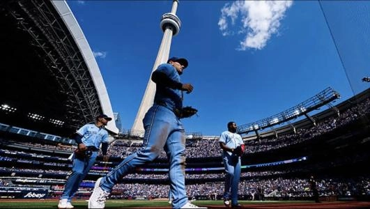 Toronto Blue Jays infielders Andres Gimenez, Addison Barger and Vladimir Guerrero Jr at Rogers Centre in Toronto Ontario, Canada.