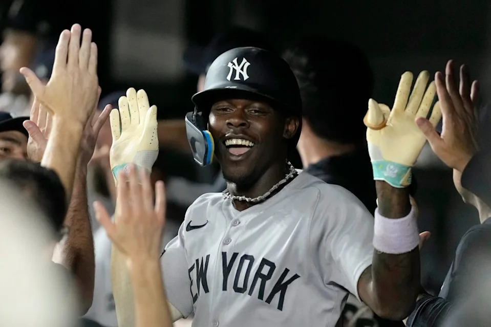Jazz Chisholm Jr. celebrates with teammates in the dugout after hitting a home run against the Baltimore Orioles. Getty Images