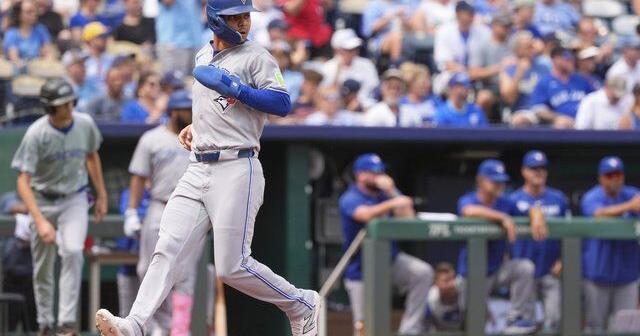 Blue Jays clinch playoff spot with 8-5 win over Royals | National Sports