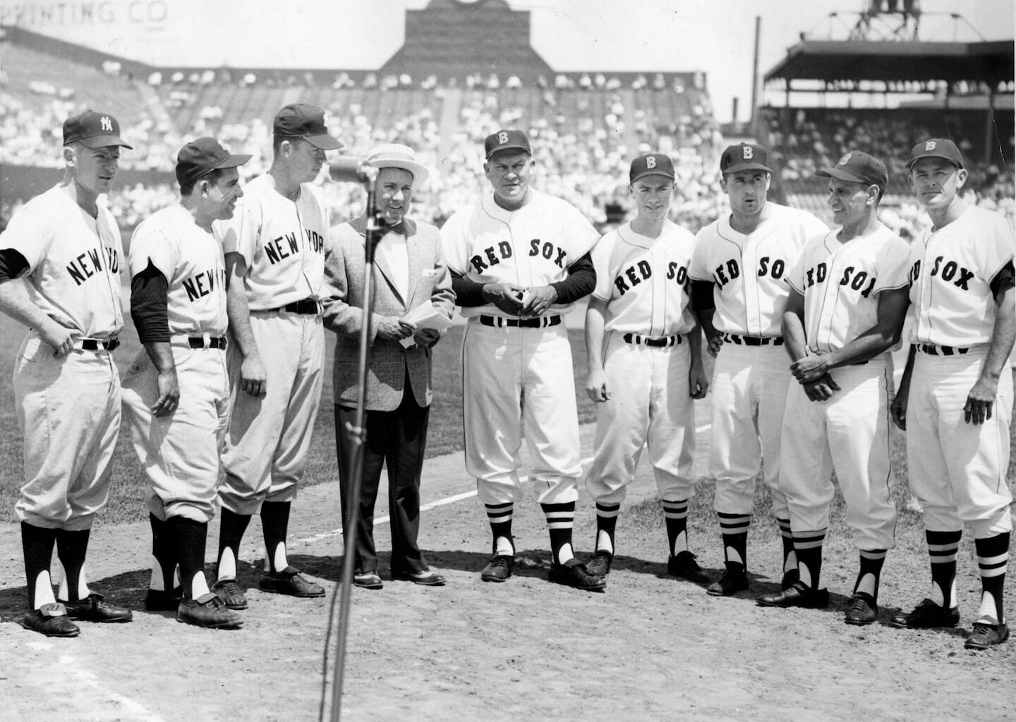 The Boston Red Sox and New York Yankees lined up for a pre-game ceremony on Rhode Island Day at Fenway Park on July 8, 1960. From left, Yankees Whitey Ford, Yogi Berra and Gil McDougald take a gander at Red Sox Pinky Higgins, Paul Needham, Bill Monbouquette, Frank Malzone and Pete Runnels. Sandwiched between the two teams is Waltham Lodge of Elks leader Bill Walsh.