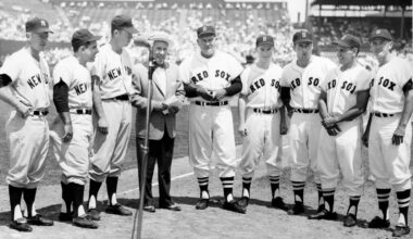 The Boston Red Sox and New York Yankees lined up for a pre-game ceremony on Rhode Island Day at Fenway Park on July 8, 1960. From left, Yankees Whitey Ford, Yogi Berra and Gil McDougald take a gander at Red Sox Pinky Higgins, Paul Needham, Bill Monbouquette, Frank Malzone and Pete Runnels. Sandwiched between the two teams is Waltham Lodge of Elks leader Bill Walsh.