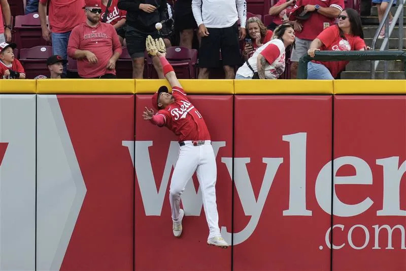 Noelvi Marte pulls the Reds' season out of the cheap seats Sept. 25 in 2-1 win over the Pirates. The catch helped preserve the victory and kept the Reds from being swept by Pittsburgh.