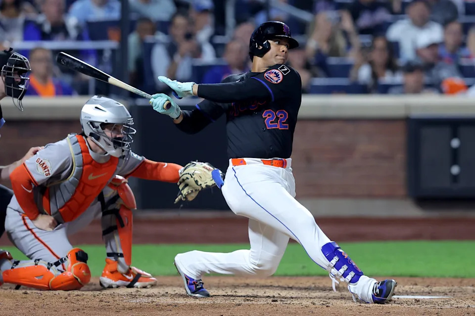 Aug 1, 2025; New York City, New York, USA; New York Mets right fielder Juan Soto (22) follows through on an RBI single against the San Francisco Giants during the eighth inning at Citi Field. Mandatory Credit: Brad Penner-Imagn Images