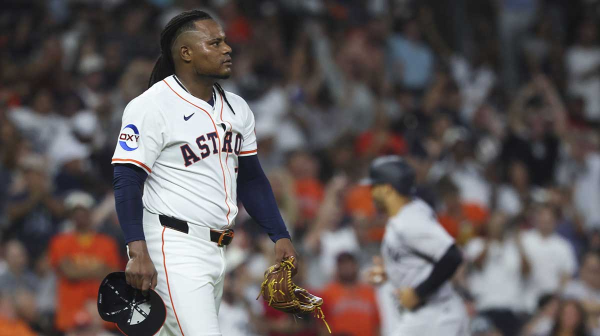 Houston Astros starting pitcher Framber Valdez (59) reacts and New York Yankees center fielder Trent Grisham (12) rounds the bases after hitting a grand slam during the fifth inning at Daikin Park. 