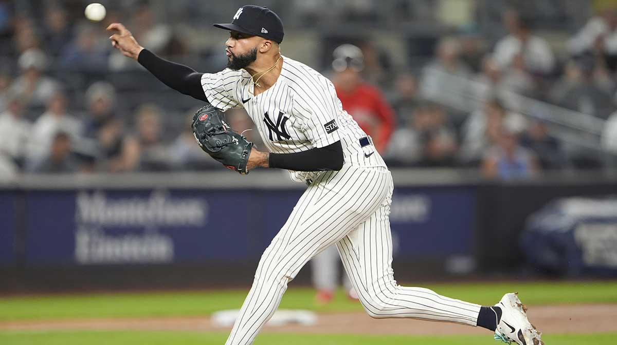 New York Yankees pitcher Devin Williams (38) delivers a pitch against the Boston Red Sox during the eighth inning at Yankee Stadium.