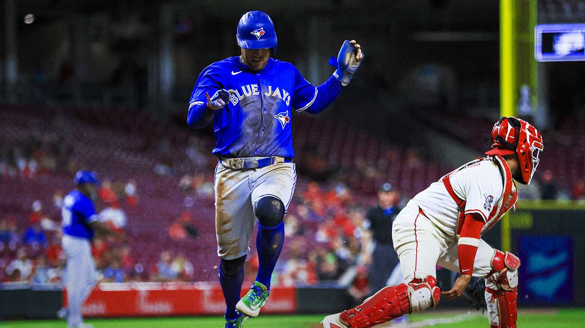 Toronto Blue Jays outfielder George Springer (4) scores on a fielder’s choice hit by shortstop Bo Bichette (not pictured) in the eighth inning against the Cincinnati Reds at Great American Ball Park. 