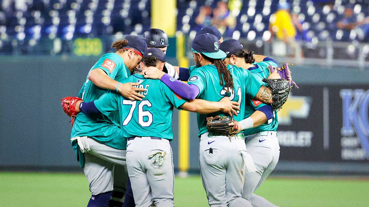 The Seattle Mariners celebrate a win against the Kansas City Royals at Kauffman Stadium. 